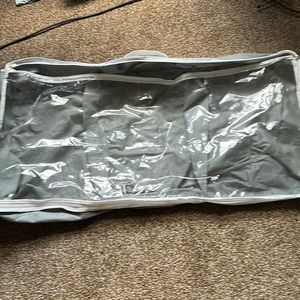 Never used - collapsable shoe storage container. Gray and white with handle